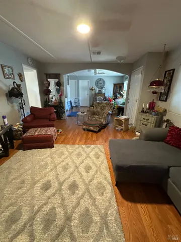 a living room with furniture and a lamp