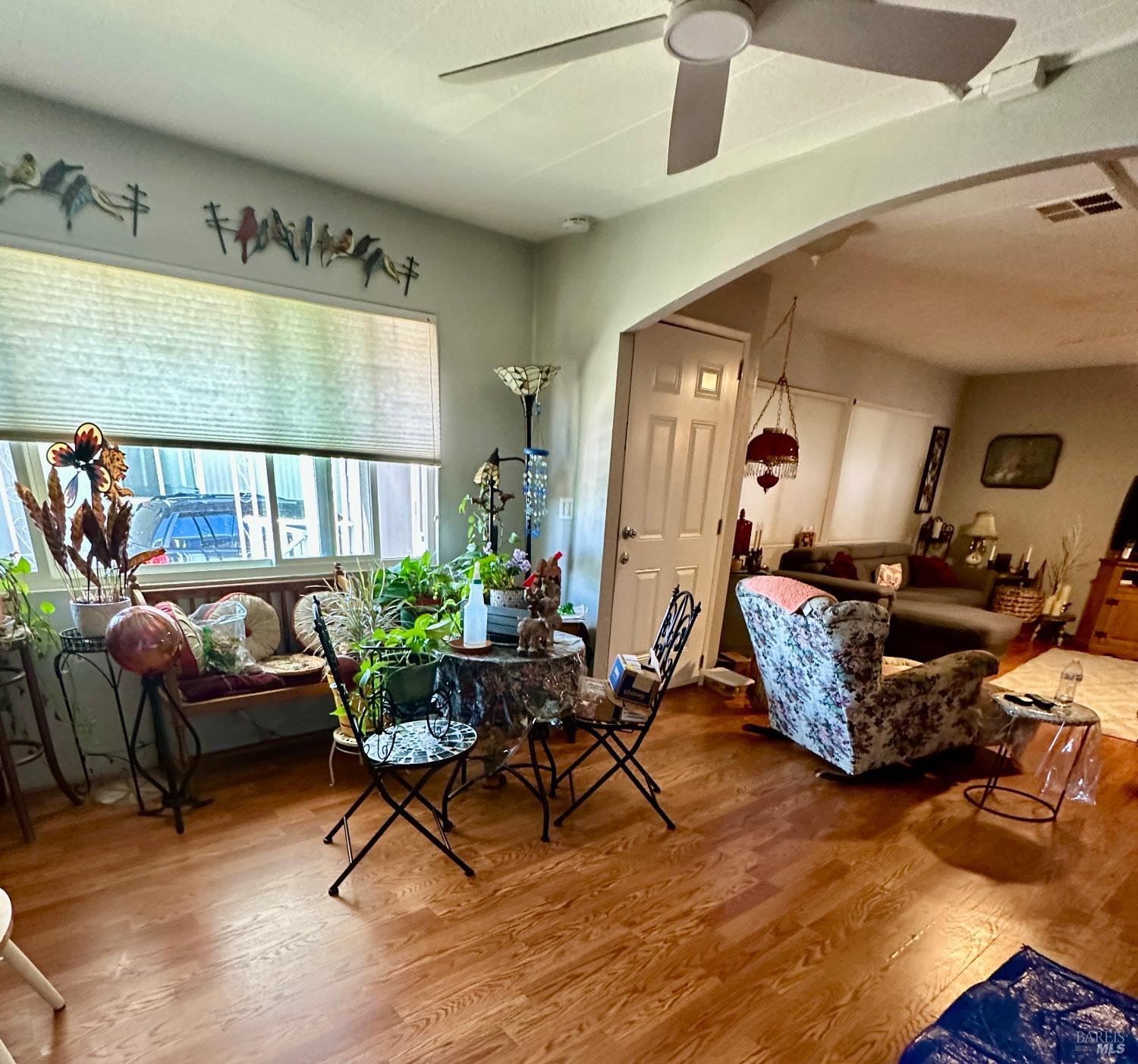 102 Royal Oak Court, Unit 102 Fairfield, CA 94533 - Photo 15 of 32 a living room with furniture and wooden floor
