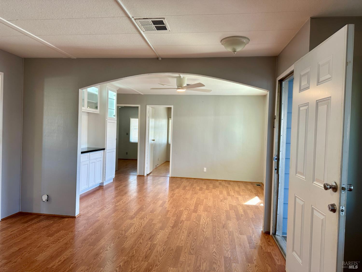 102 Royal Oak Court, Unit 102 Fairfield, CA 94533 - Photo 2 of 32 wooden floor in an empty room with a window