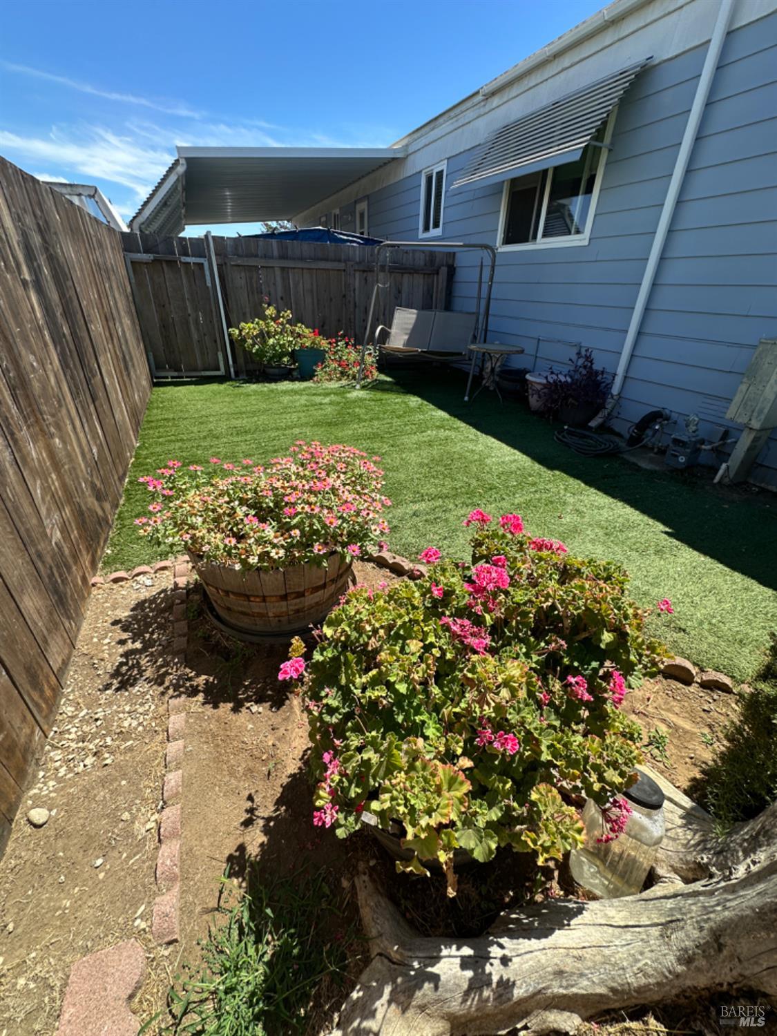 102 Royal Oak Court, Unit 102 Fairfield, CA 94533 - Photo 26 of 32 a view of a backyard with potted plants