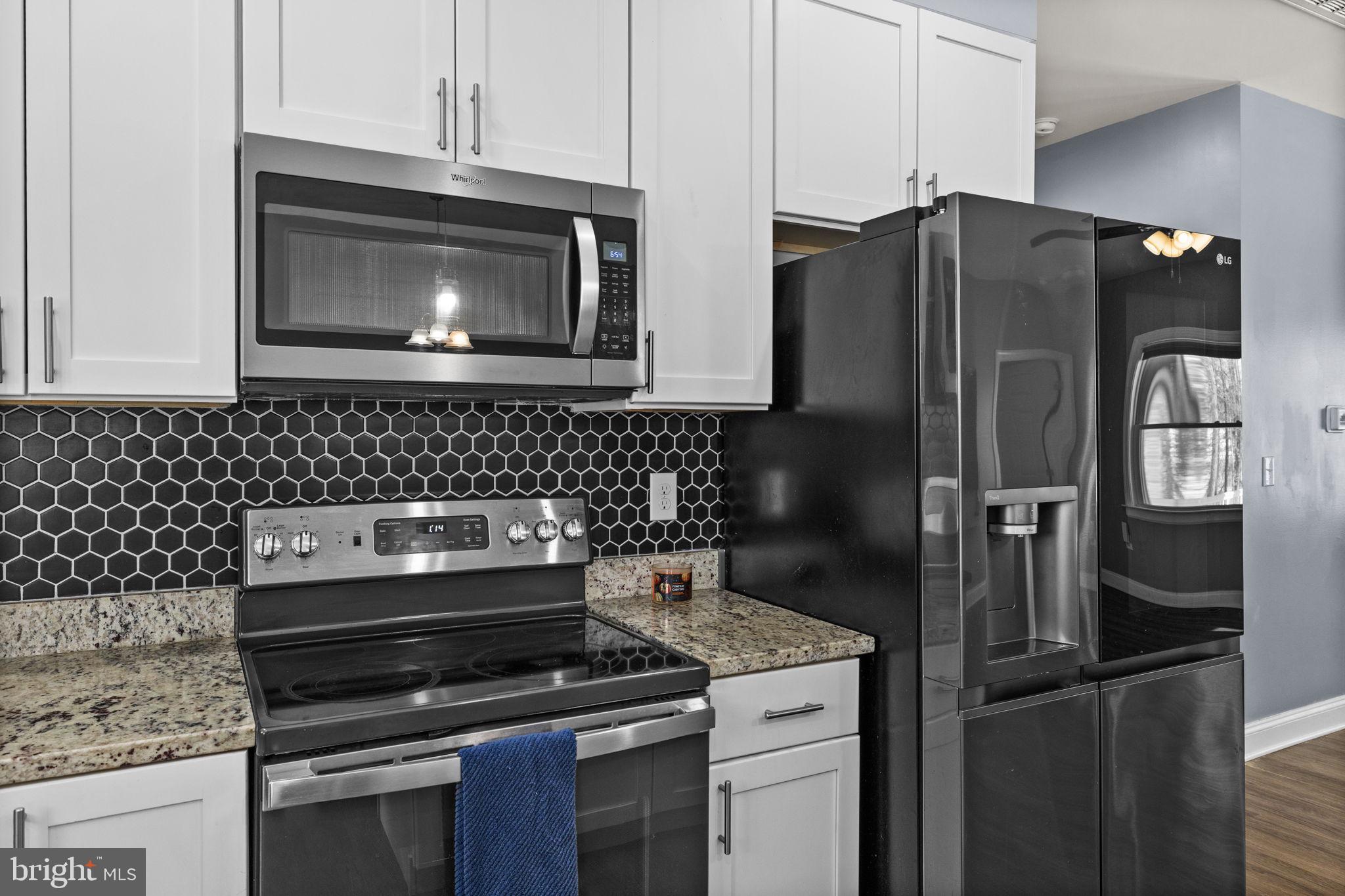 820 Kennon Road Mineral, VA 23117 - Photo 15 of 43 a kitchen with a refrigerator stove and microwave
