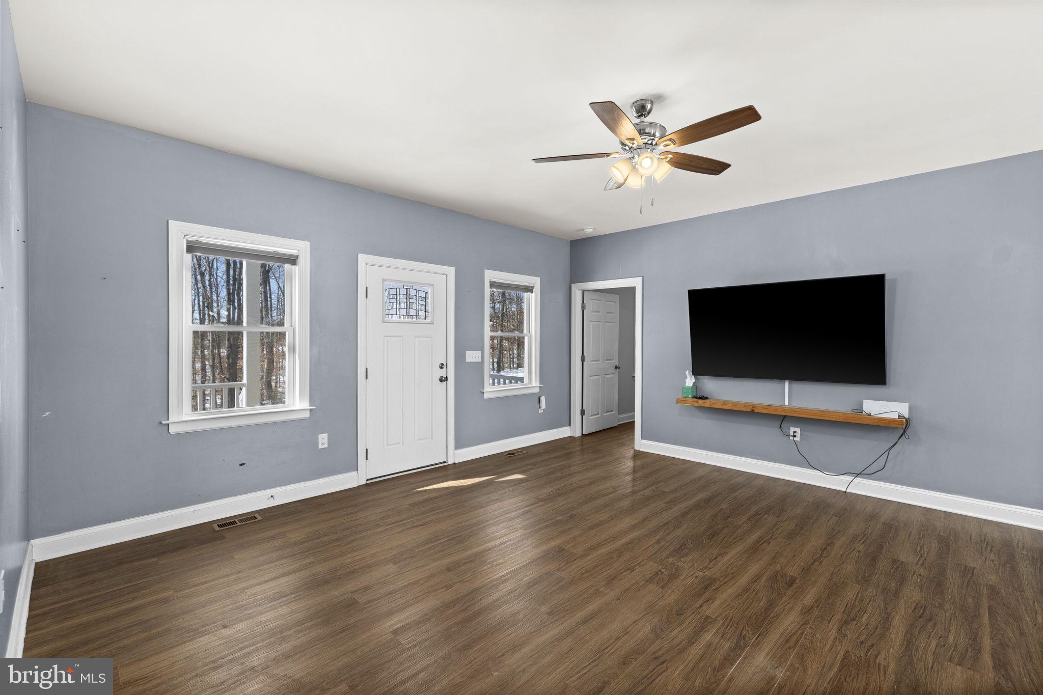 820 Kennon Road Mineral, VA 23117 - Photo 20 of 43 a living room with window and a flat screen tv