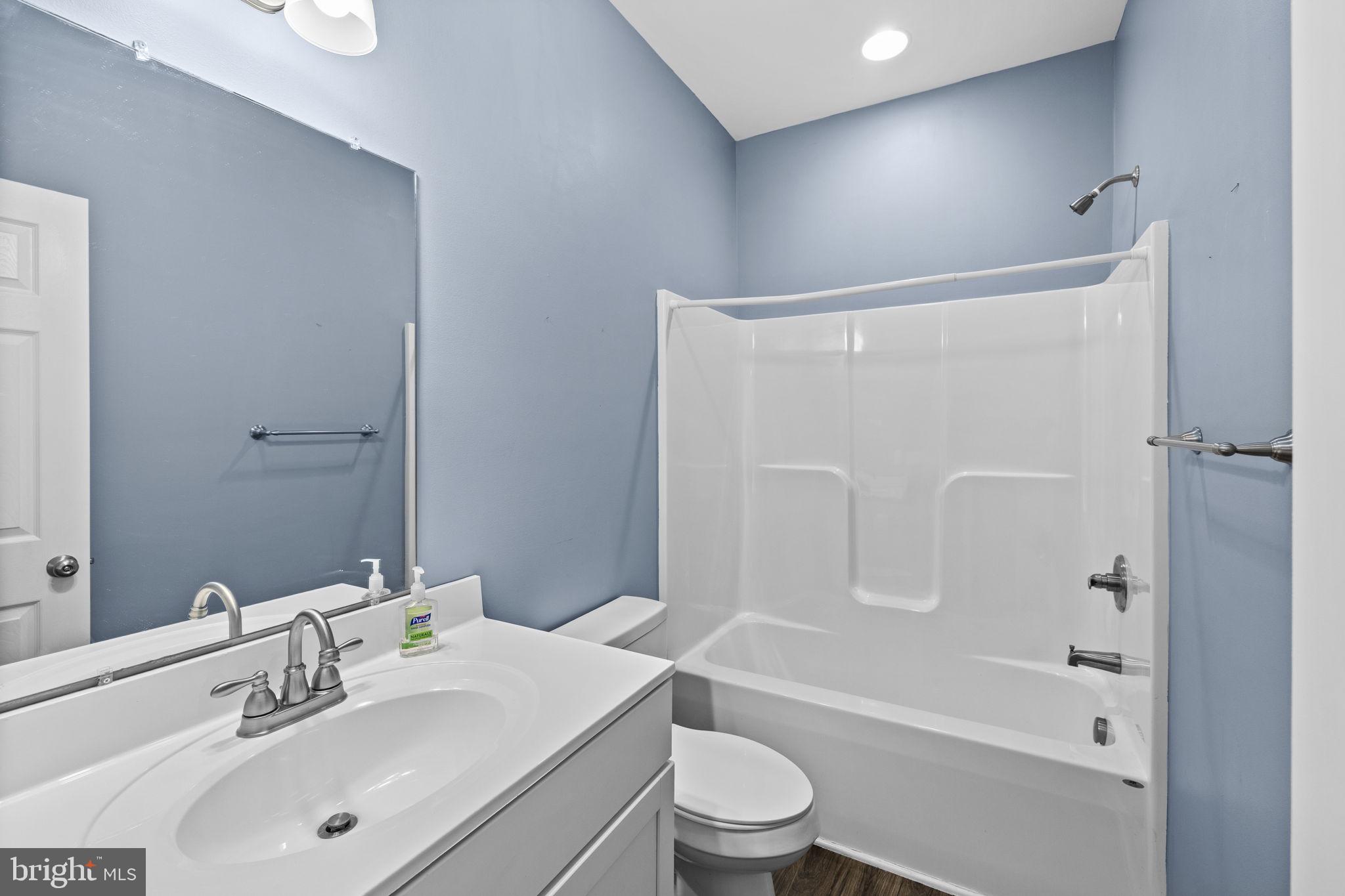 820 Kennon Road Mineral, VA 23117 - Photo 22 of 43 a bathroom with a sink mirror toilet and bathtub