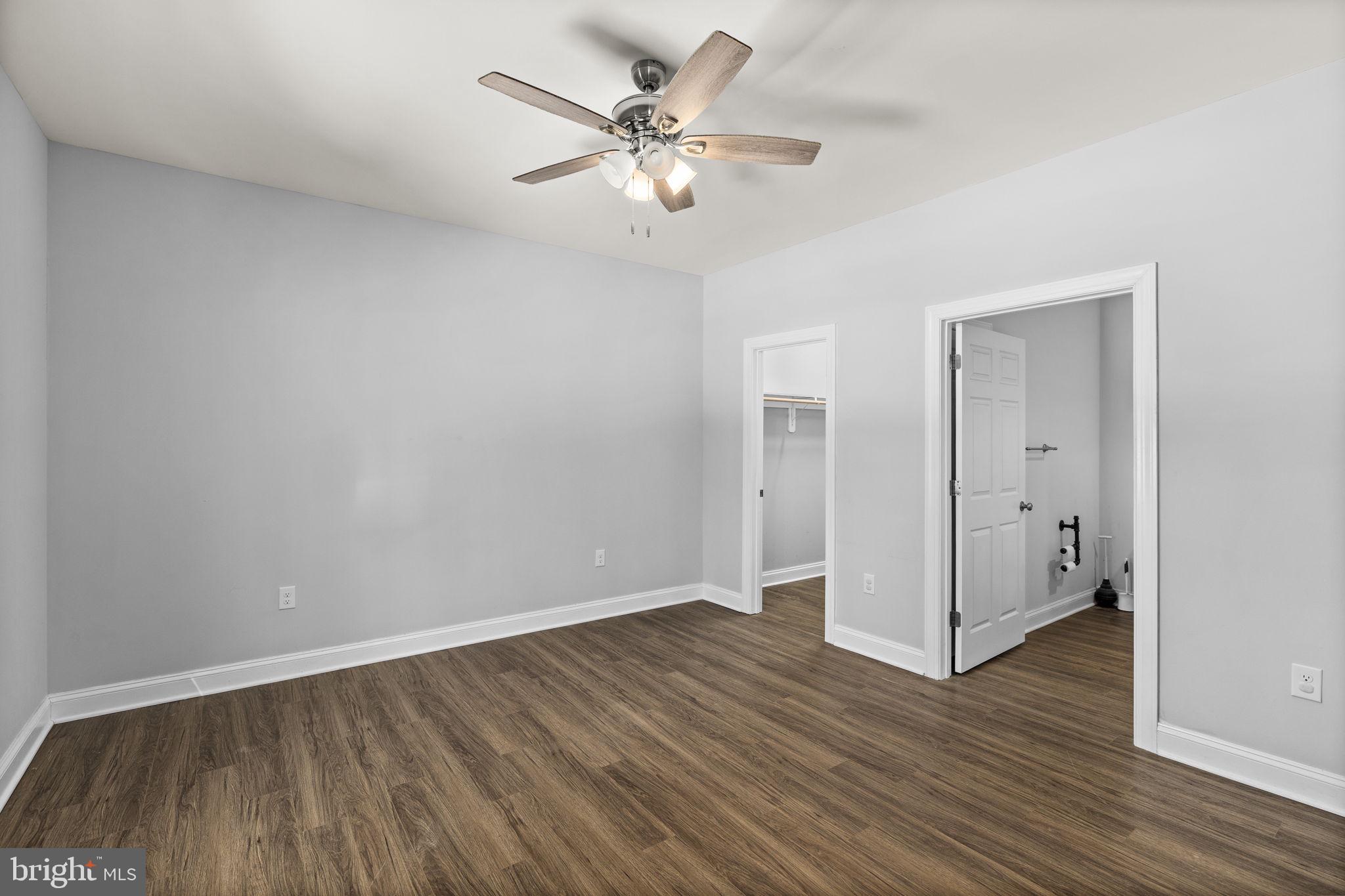 820 Kennon Road Mineral, VA 23117 - Photo 26 of 43 an empty room with wooden floor and ceiling fan