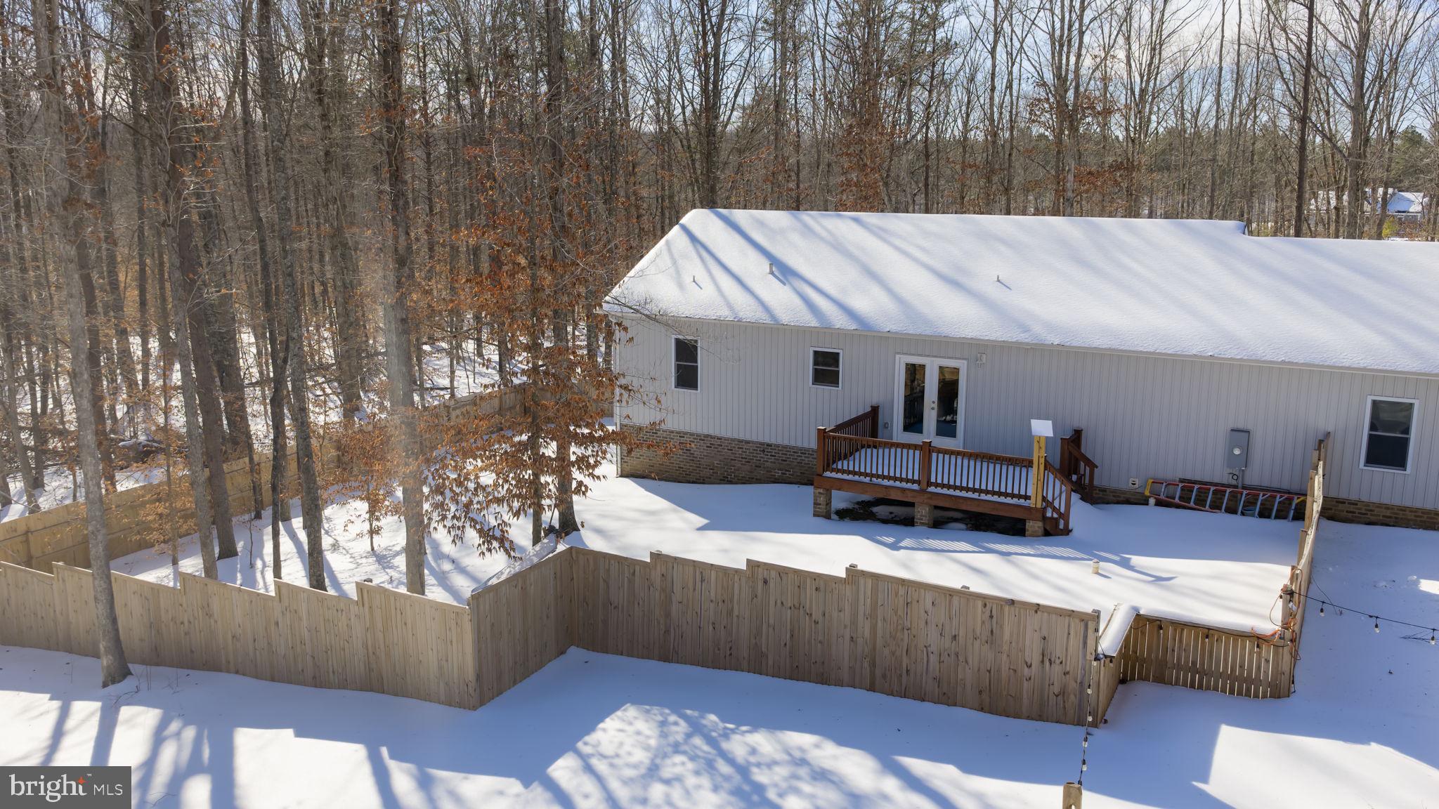 820 Kennon Road Mineral, VA 23117 - Photo 31 of 43 a living room with furniture and a chandelier