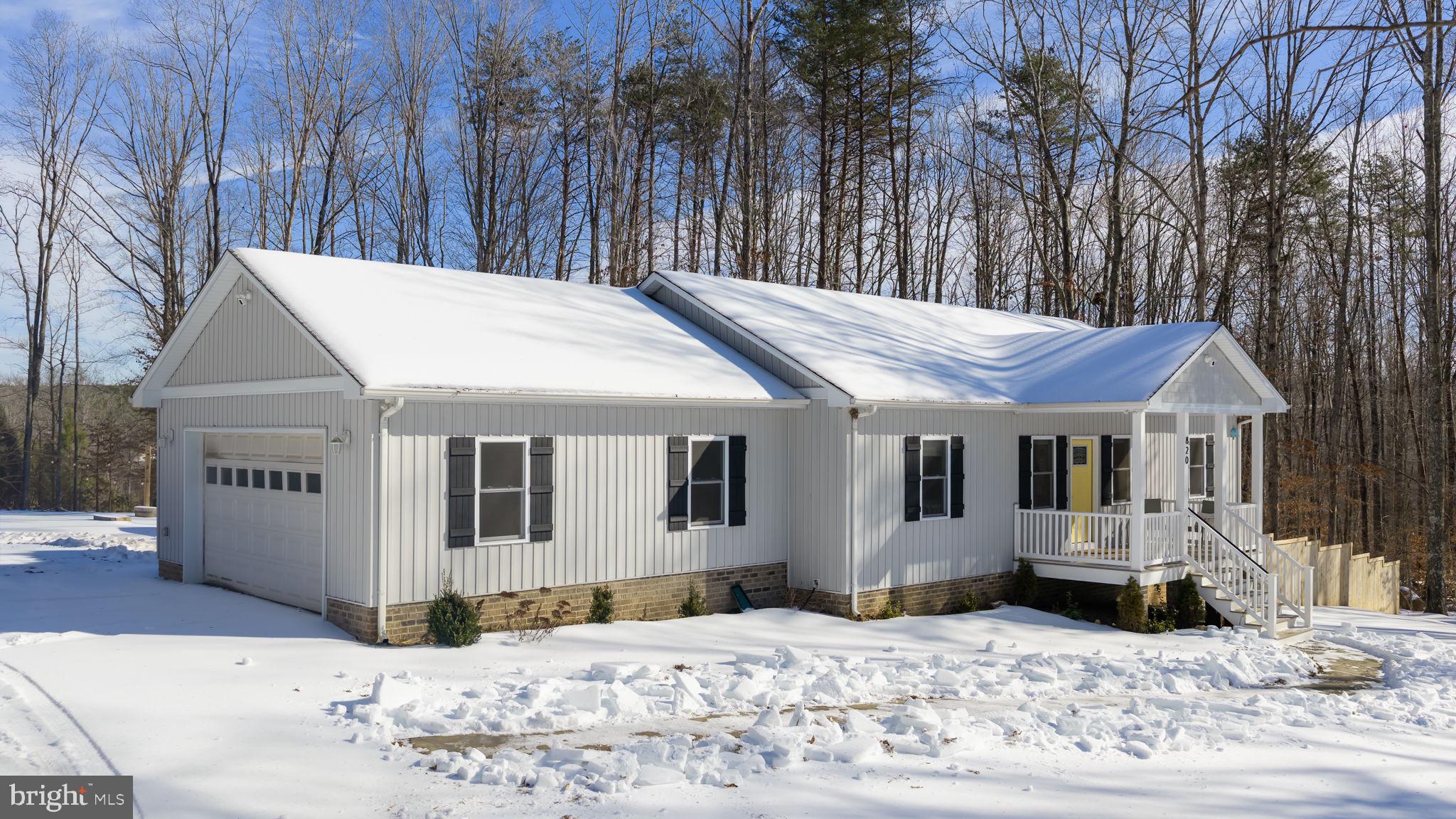 820 Kennon Road Mineral, VA 23117 - Photo 37 of 43 a view of a house with snow on the side of the road