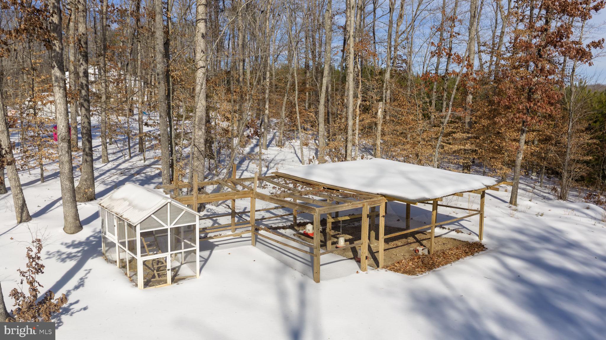 820 Kennon Road Mineral, VA 23117 - Photo 41 of 43 a view of a patio with table and chairs with wooden fence