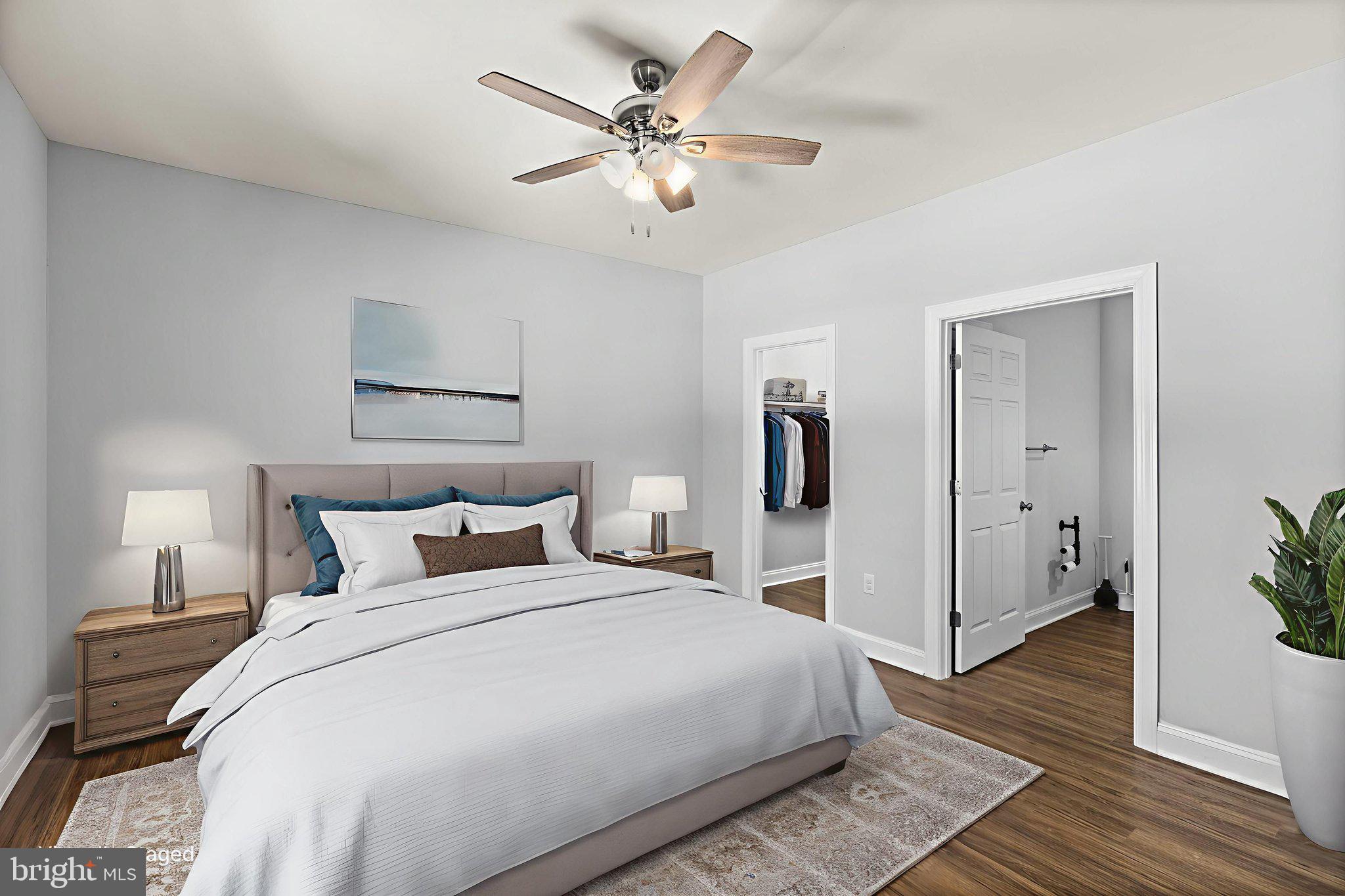 820 Kennon Road Mineral, VA 23117 - Photo 6 of 43 a bedroom with a large bed and a chandelier