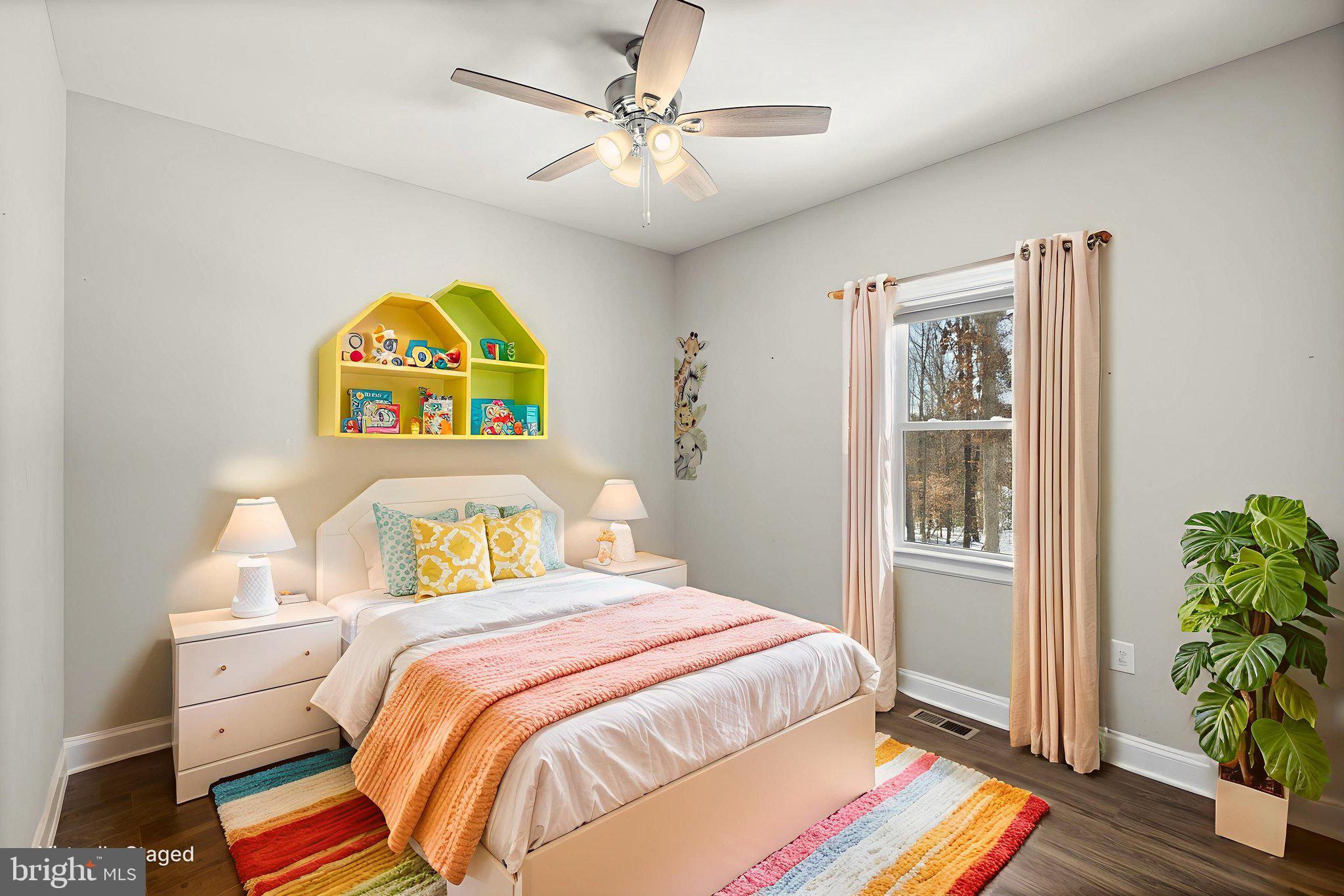 820 Kennon Road Mineral, VA 23117 - Photo 9 of 43 a bedroom with a bed and a potted plant