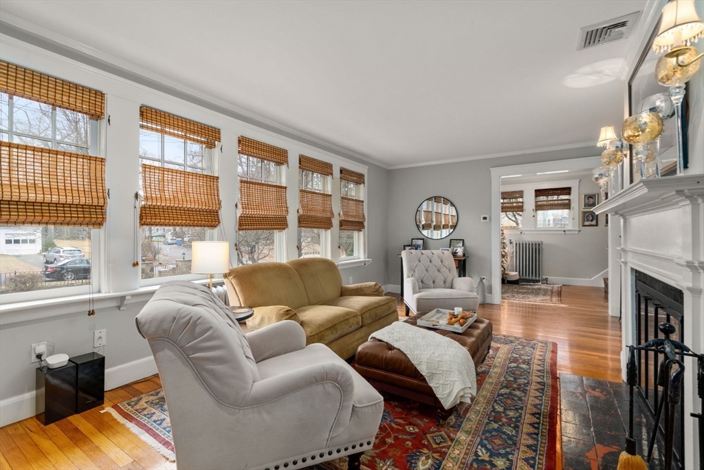 47 Summit Road Wellesley, MA 02482 - Photo 11 of 42 a living room with furniture fireplace and a large window