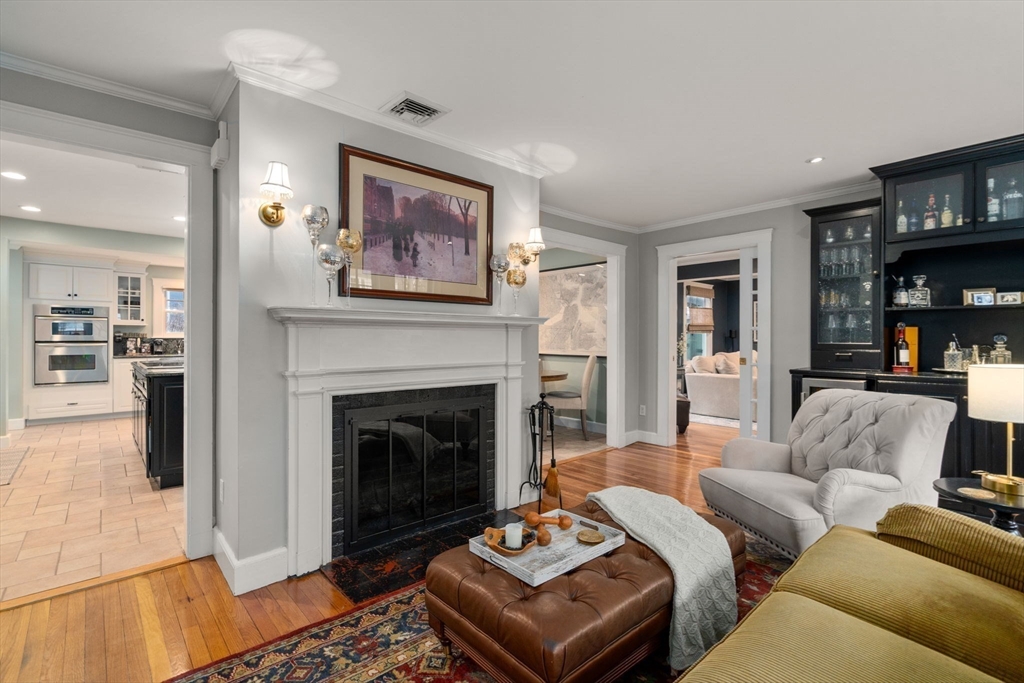 47 Summit Road Wellesley, MA 02482 - Photo 13 of 42 a living room with furniture and a fireplace