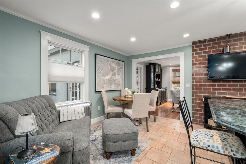 47 Summit Road Wellesley, MA 02482 - Photo 15 of 42 a living room with furniture and a flat screen tv