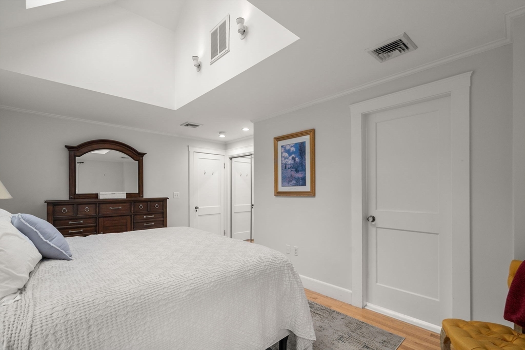 47 Summit Road Wellesley, MA 02482 - Photo 22 of 42 a bedroom with a large bed and a window