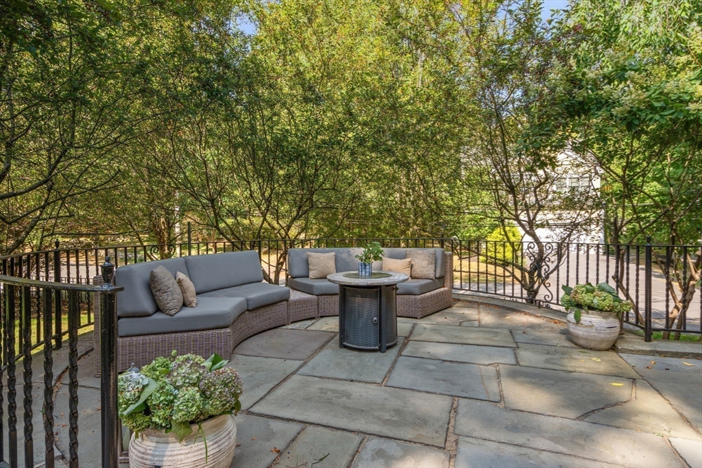47 Summit Road Wellesley, MA 02482 - Photo 29 of 42 a view of a patio with couches and potted plants