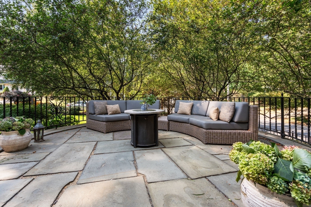 47 Summit Road Wellesley, MA 02482 - Photo 30 of 42 a view of a patio with couches and potted plants