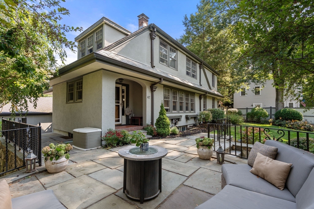 47 Summit Road Wellesley, MA 02482 - Photo 31 of 42 a view of a house with patio in the backyard