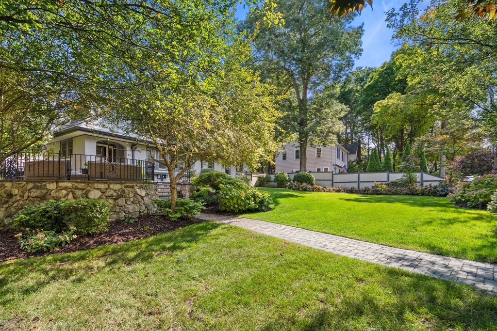 47 Summit Road Wellesley, MA 02482 - Photo 33 of 42 a front view of a house with garden