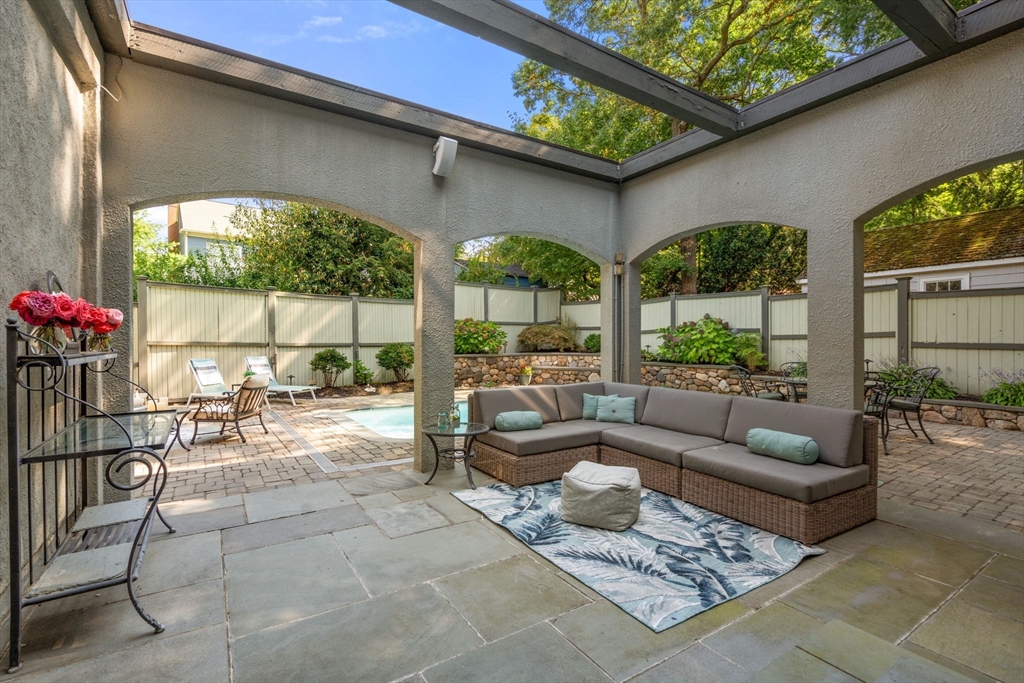 47 Summit Road Wellesley, MA 02482 - Photo 37 of 42 a living room with furniture and a floor to ceiling window