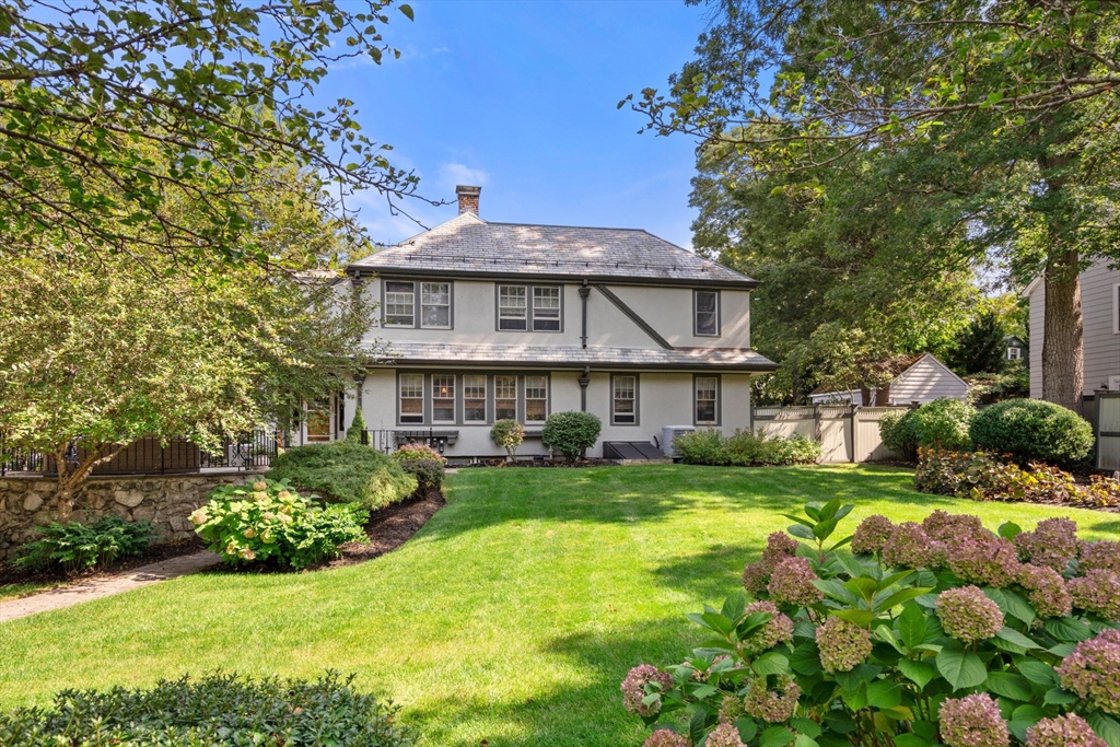 47 Summit Road Wellesley, MA 02482 - Photo 41 of 42 a view of a house with a big yard potted plants and large tree