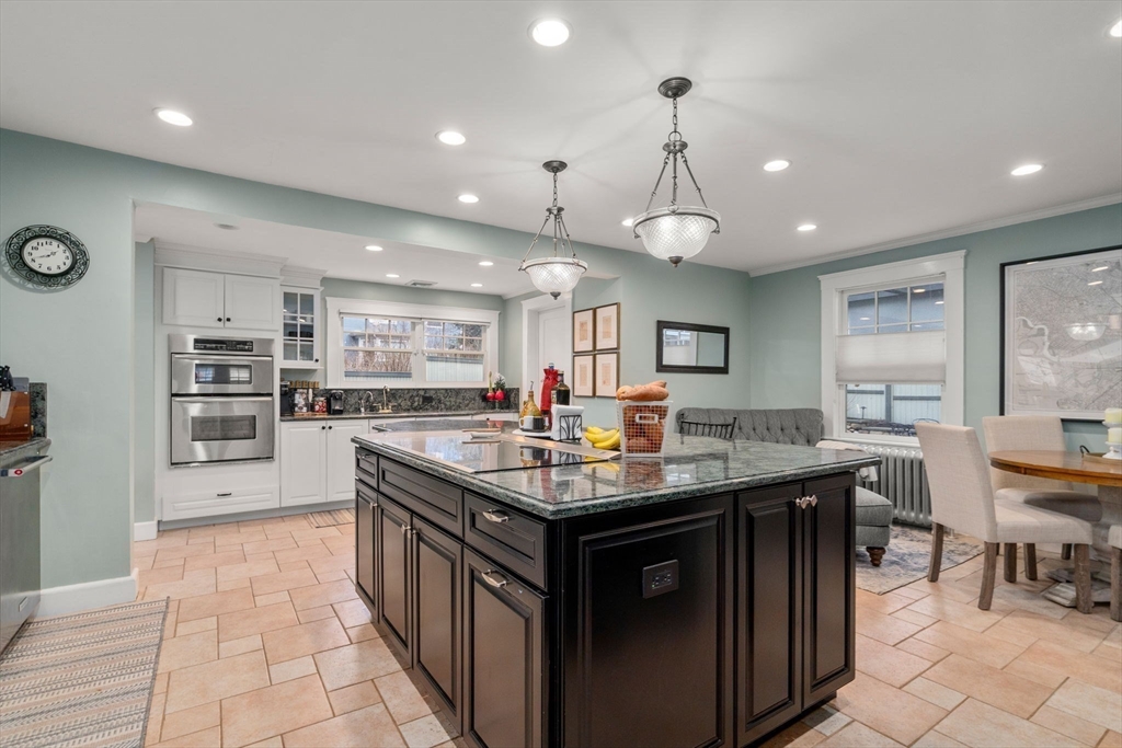 47 Summit Road Wellesley, MA 02482 - Photo 5 of 42 a kitchen with stainless steel appliances granite countertop a kitchen island a stove and a sink