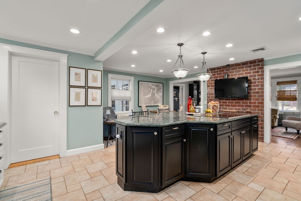 47 Summit Road Wellesley, MA 02482 - Photo 6 of 42 a kitchen with stainless steel appliances granite countertop a sink and a stove