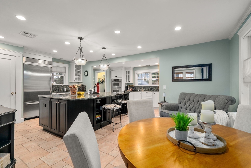 47 Summit Road Wellesley, MA 02482 - Photo 8 of 42 a living room with kitchen island furniture and a dining table