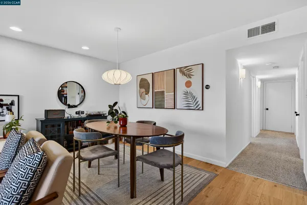 a kitchen with a table and chairs in it
