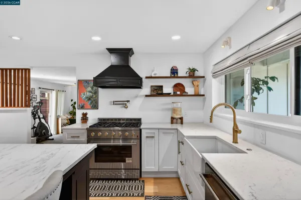 a room with furniture a large window and a table