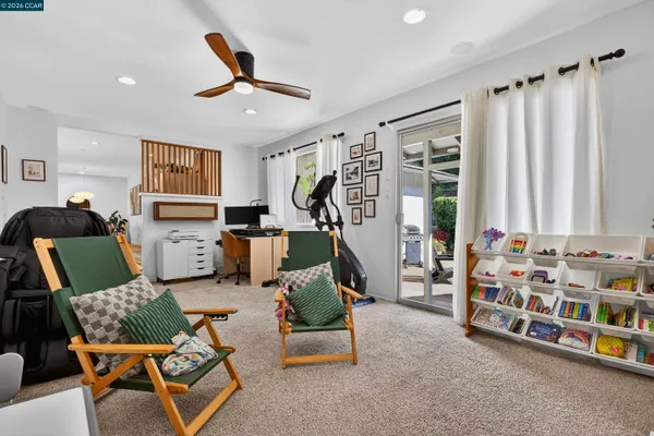 a living room with furniture and a window