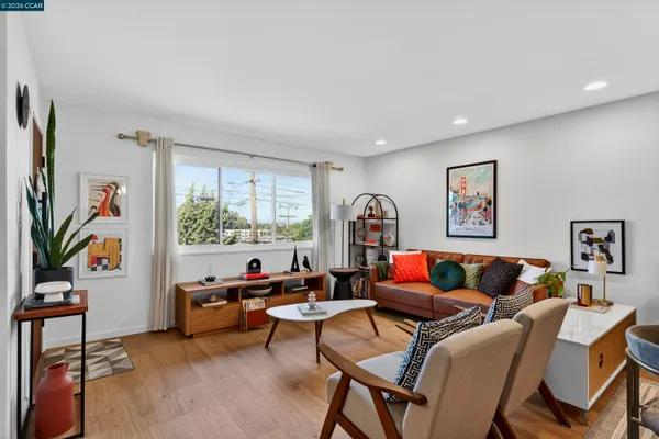 a living room with furniture and a large window