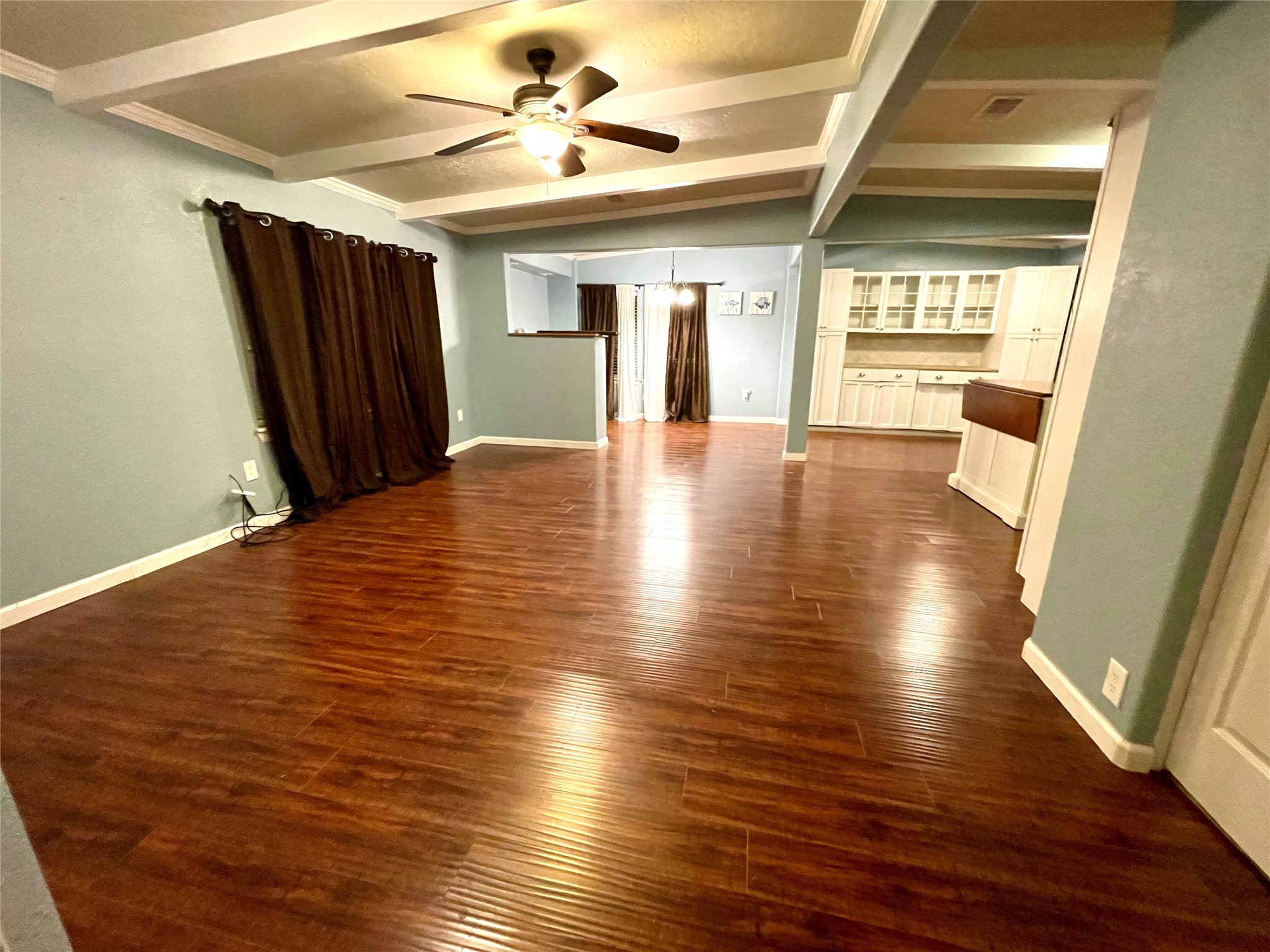 318 Marine Way Freeport, TX 77541 - Photo 6 of 17 a view of an empty room with wooden floor and a window