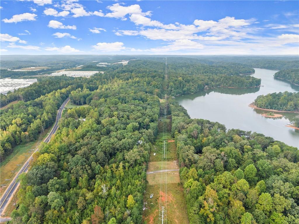 4193 Cagle Road Lula, GA 30554 - Photo 5 of 24 a view of a lake with a yard