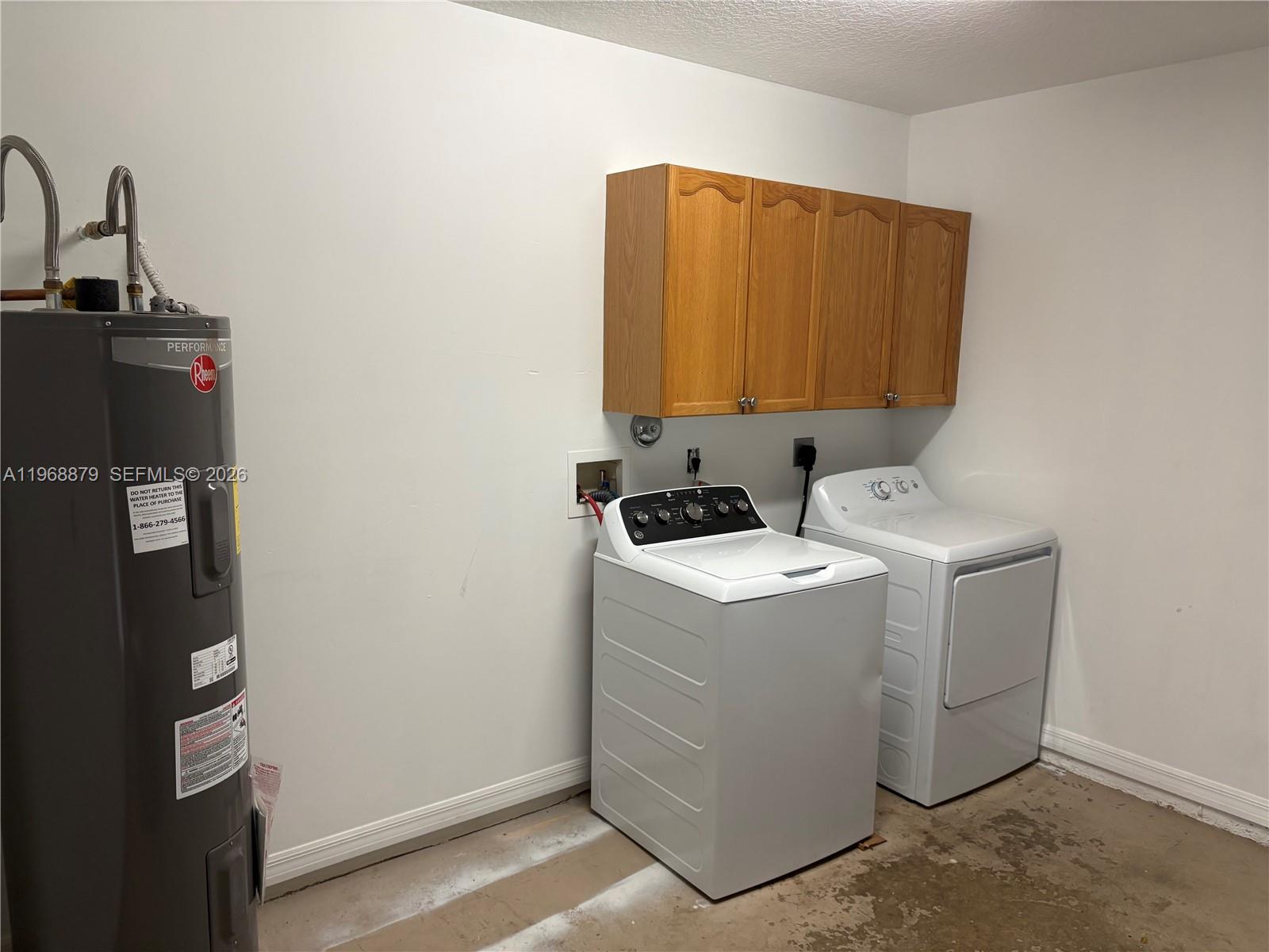3836 Dove Landing Road West Palm Beach, FL 33403 - Photo 12 of 53 a utility room with dryer and washer
