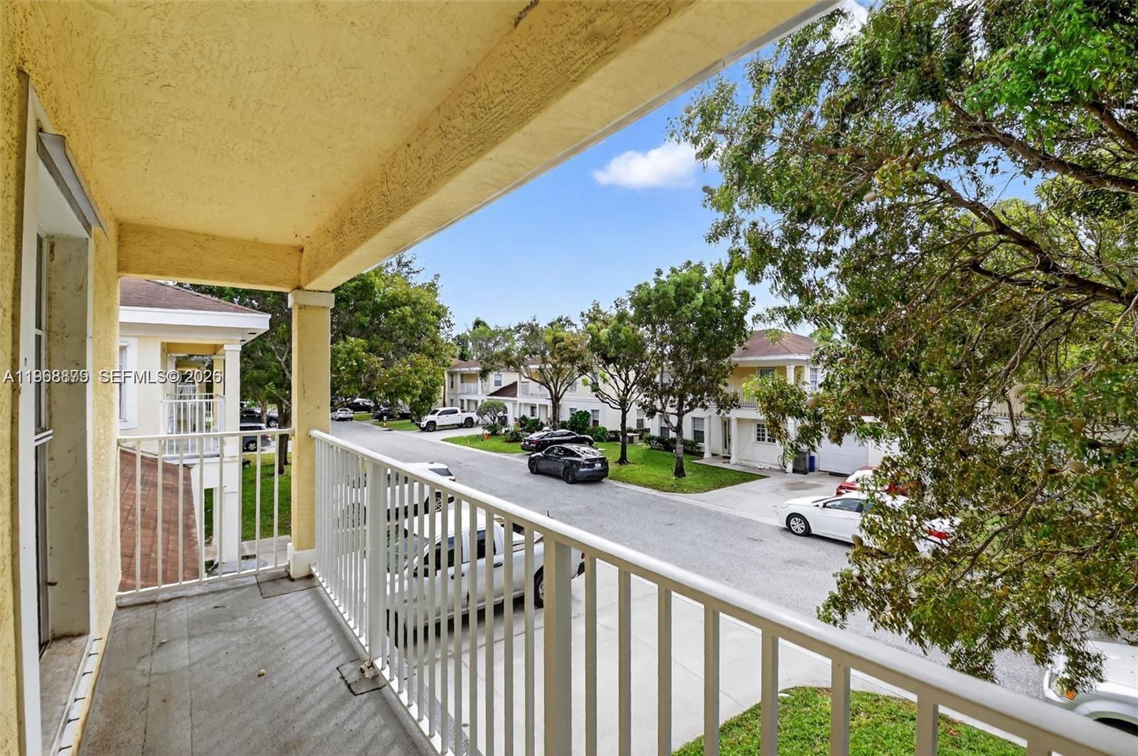 3836 Dove Landing Road West Palm Beach, FL 33403 - Photo 13 of 53 a view of a balcony and trees