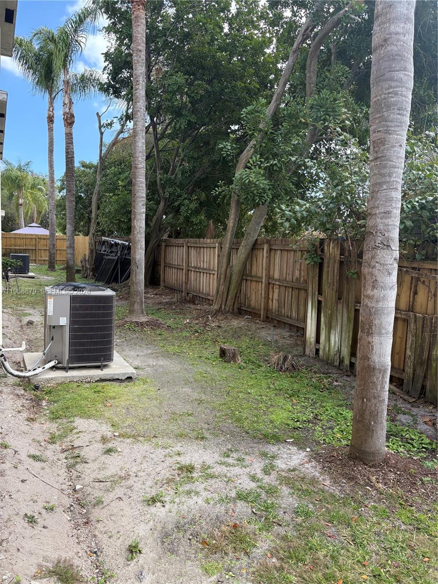 3836 Dove Landing Road West Palm Beach, FL 33403 - Photo 15 of 53 a backyard of a house with lots of green space