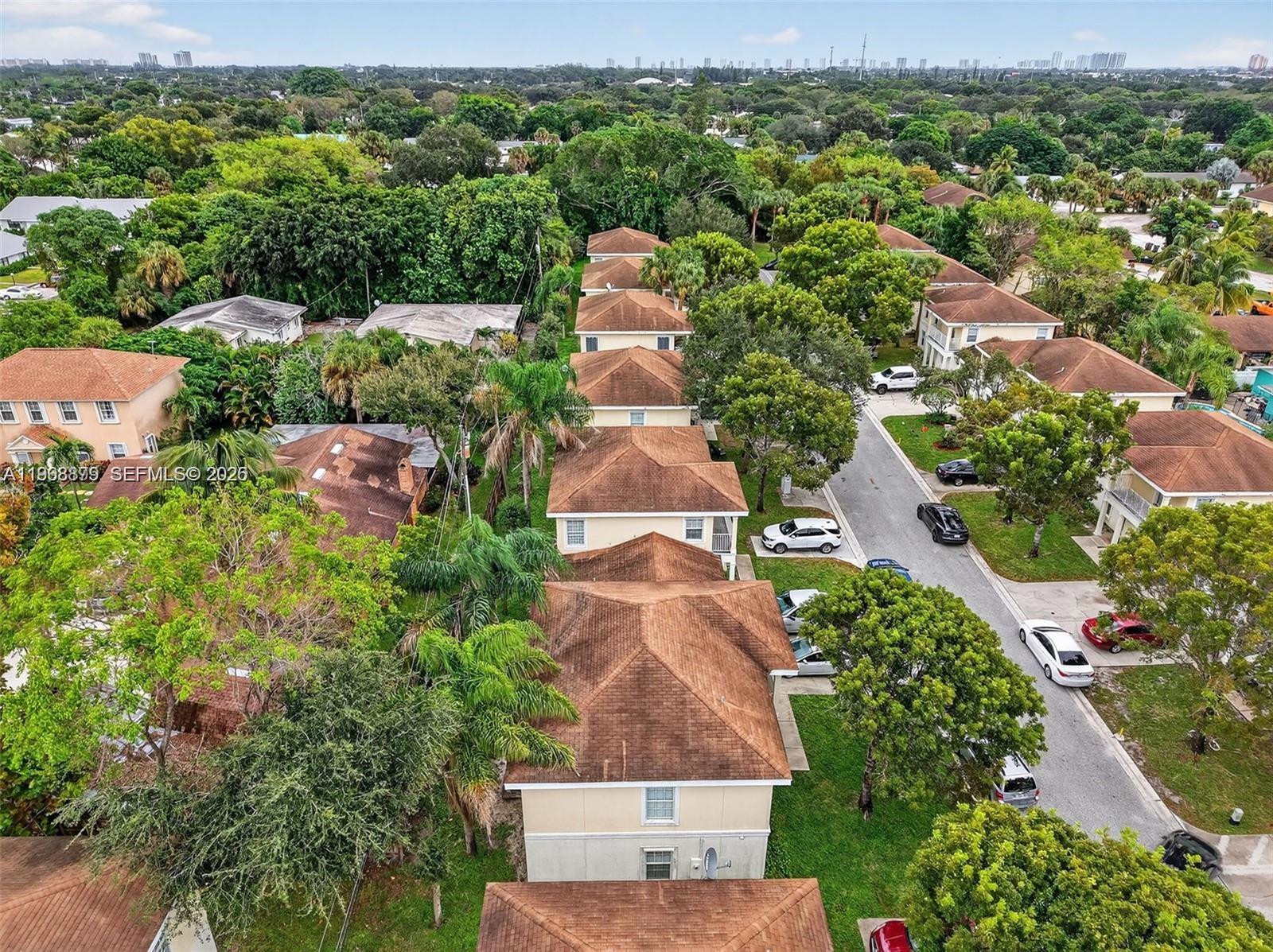 3836 Dove Landing Road West Palm Beach, FL 33403 - Photo 18 of 53 an aerial view of a house with a yard and mountain view