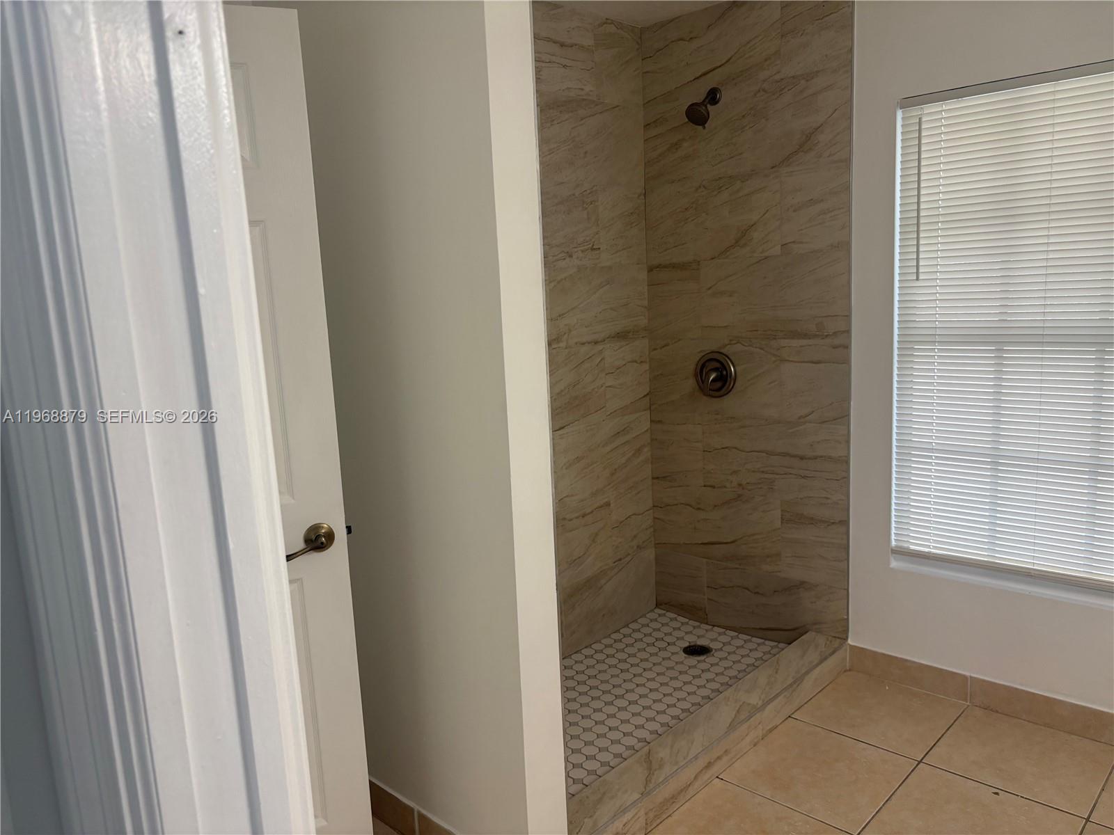 3836 Dove Landing Road West Palm Beach, FL 33403 - Photo 24 of 53 a bathroom with a shower and a sink