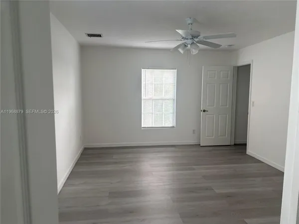 a view of an empty room with a window