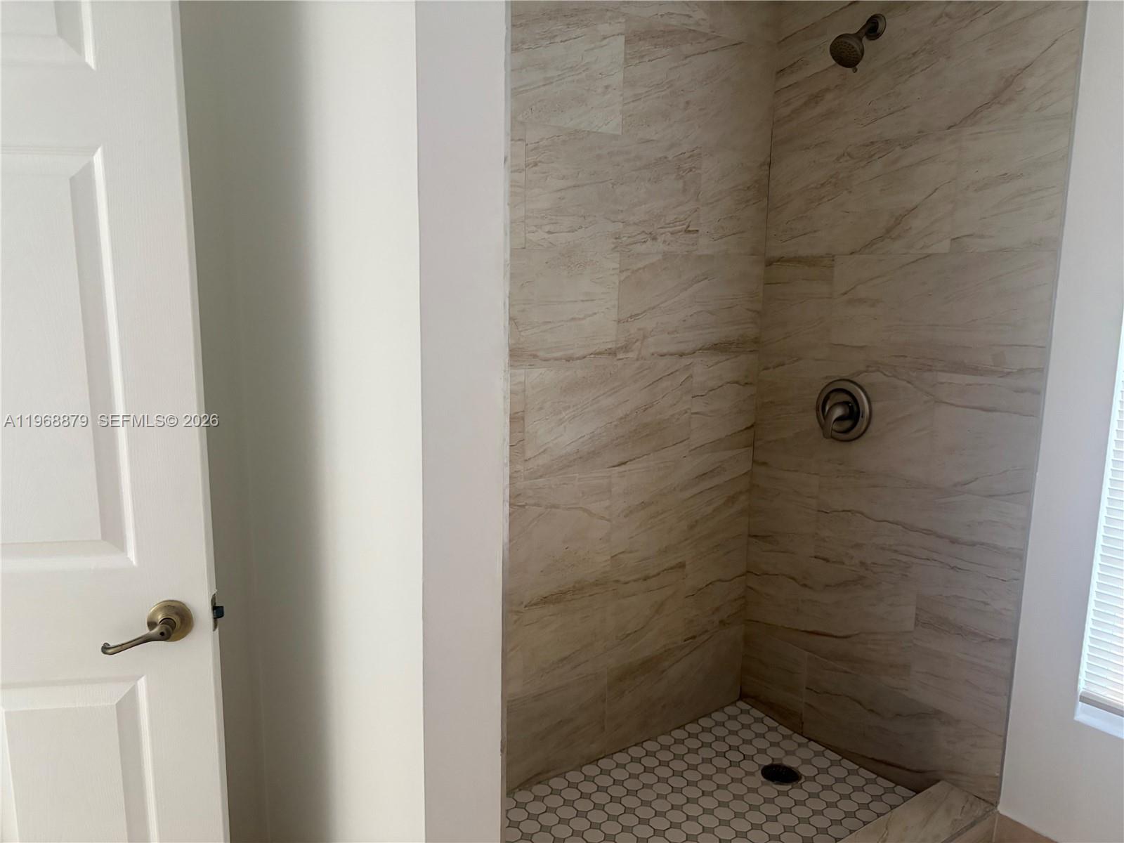 3836 Dove Landing Road West Palm Beach, FL 33403 - Photo 30 of 53 a bathroom with a shower