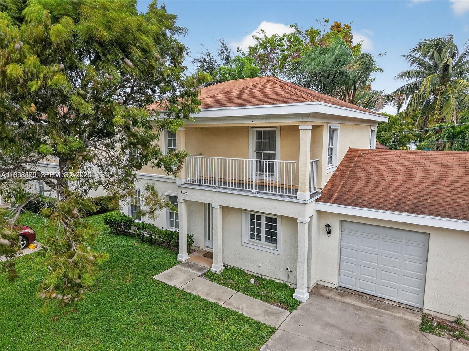 3836 Dove Landing Road West Palm Beach, FL 33403 - Photo 3 of 53 a front view of a house with a garden