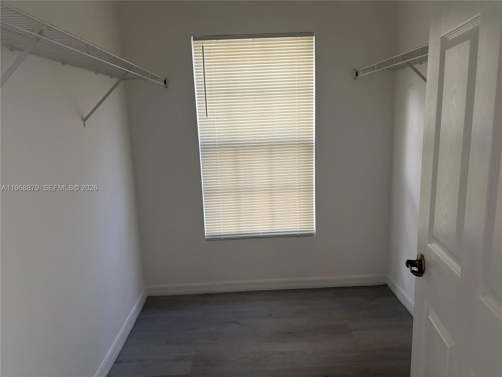 3836 Dove Landing Road West Palm Beach, FL 33403 - Photo 31 of 53 a view of an empty room with a window