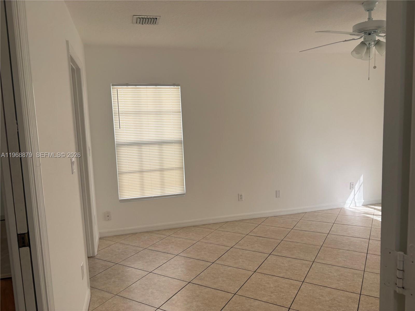 3836 Dove Landing Road West Palm Beach, FL 33403 - Photo 43 of 53 a view of an empty room and window