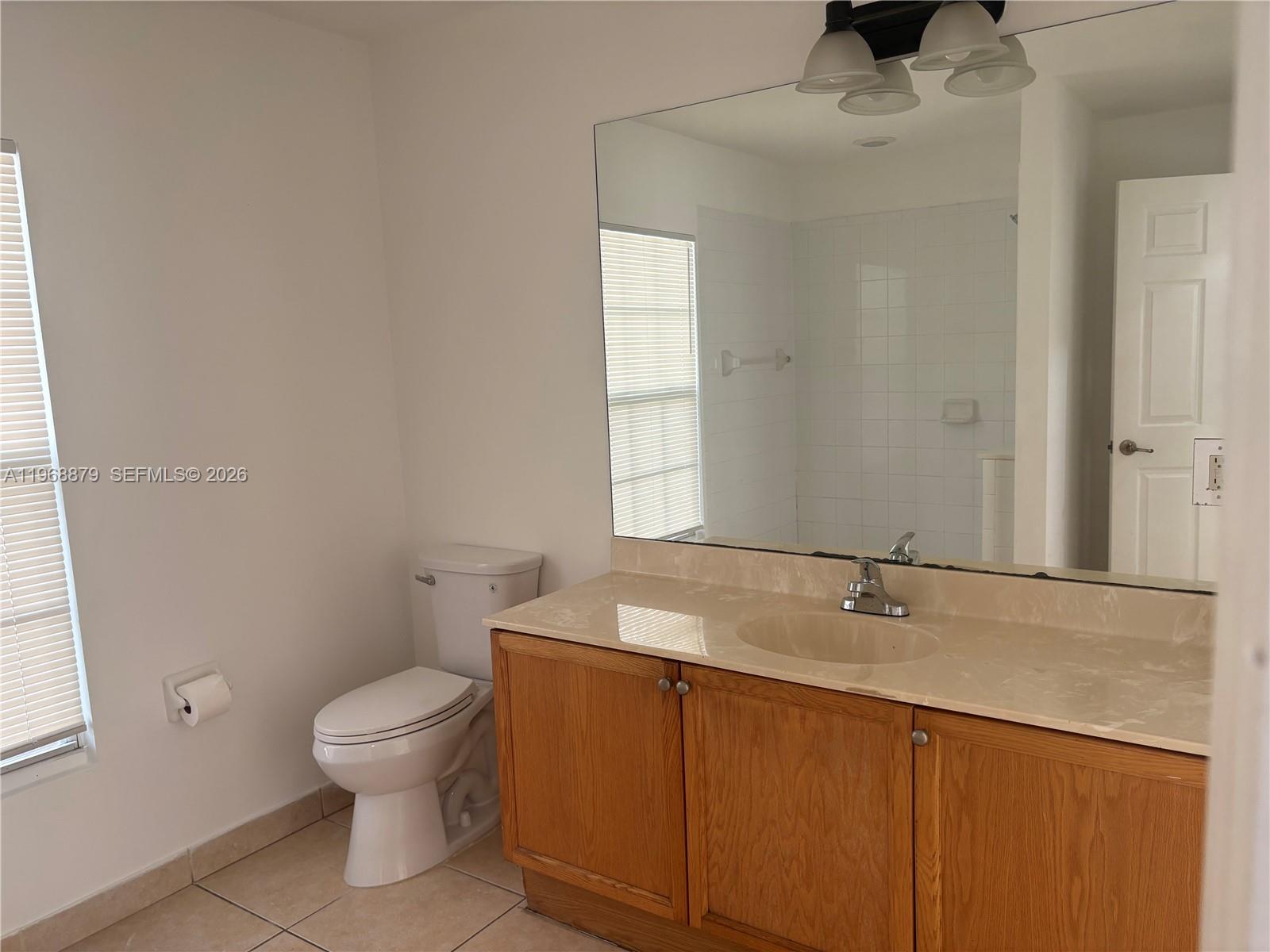 3836 Dove Landing Road West Palm Beach, FL 33403 - Photo 44 of 53 a bathroom with a sink and toilet