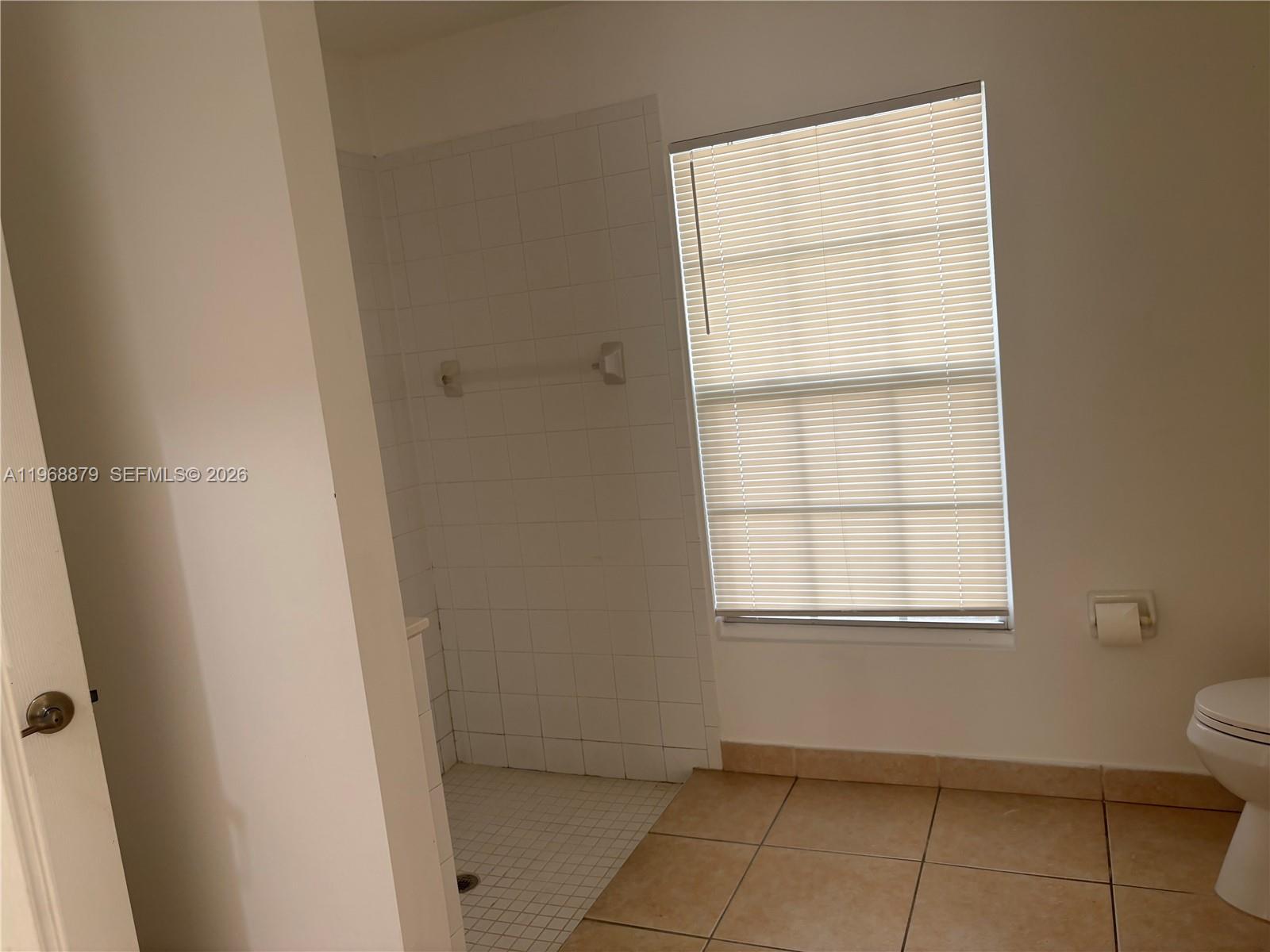 3836 Dove Landing Road West Palm Beach, FL 33403 - Photo 45 of 53 a view of an empty room with a window