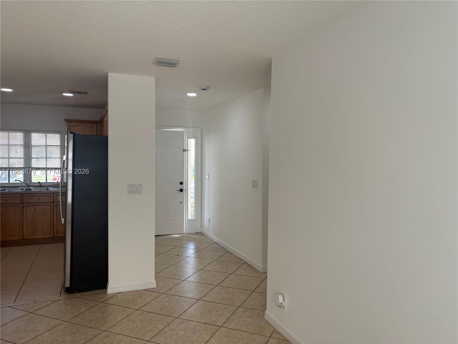 3836 Dove Landing Road West Palm Beach, FL 33403 - Photo 49 of 53 a view of a hallway with wooden shelves