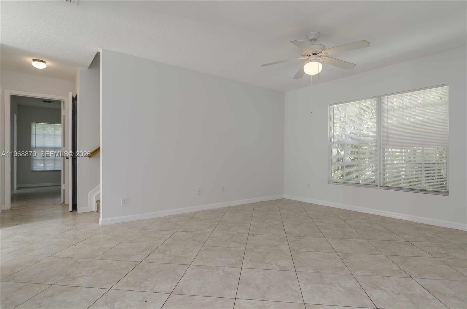 3836 Dove Landing Road West Palm Beach, FL 33403 - Photo 5 of 53 an empty room with windows and closet