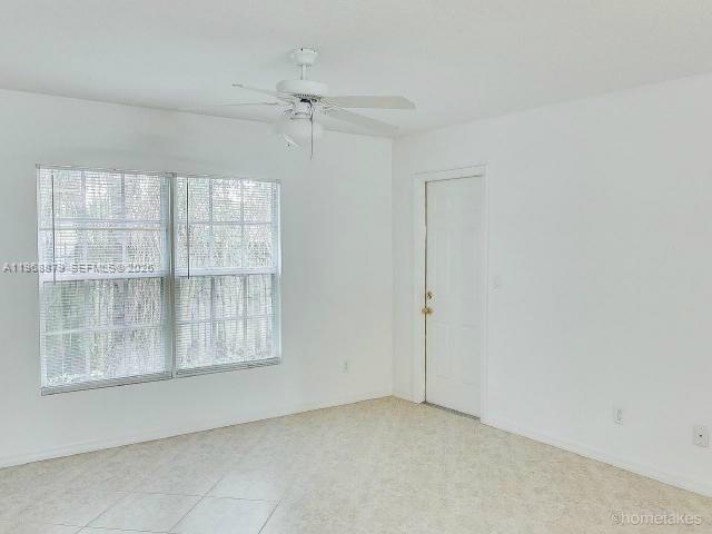 3836 Dove Landing Road West Palm Beach, FL 33403 - Photo 9 of 53 an empty room with windows and closet