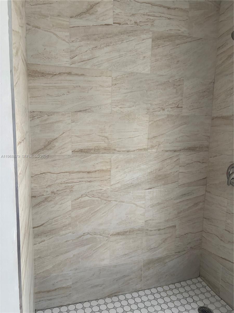 3836 Dove Landing Road West Palm Beach, FL 33403 - Photo 10 of 53 a bathroom with a shower