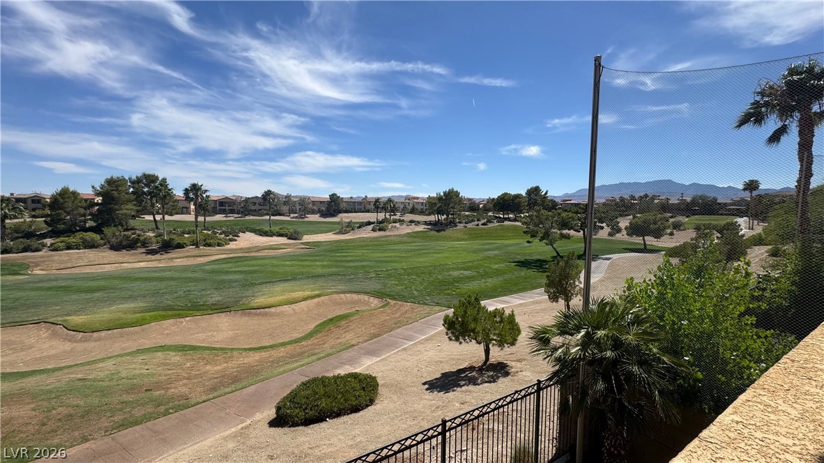 87 Tall Ruff Drive Las Vegas, NV 89148 - Photo 37 of 71 Vast greens and distant mountains create a serene golf course panorama.