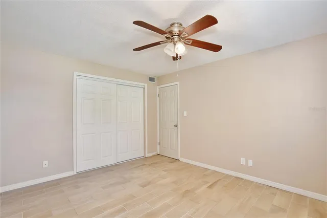 a bathroom with a sink toilet vanity and shower
